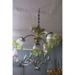 A 19TH CENTURY EMBOSSED BRASS FROSTED AND GREEN GLASS FOUR BRANCH CENTRE LIGHT with reeded scroll