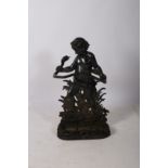 A GOOD 19TH CENTURY CAST IRON STICK STAND modelled as a young child holding a serpent base above a