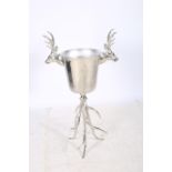 A LARGE WHITE METAL WINE COOLER of cylindrical tapering form with figural mask handles raised on