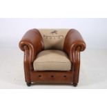 A VICTORIAN DESIGN ARMCHAIR with scroll over back and arms and loose cushion inscribed Polo on bun