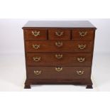 A FINE GEORGIAN MAHOGANY CHEST of rectangular outline the shaped top above three short and three