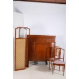 A KIDNEY SHAPED DRESSING TABLE with shield shaped mirror and five frieze drawers on reeded and ring