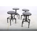 A SET OF FOUR RETRO STOOLS each with a circular adjustable seat on tubular legs 54cm (h) x 41cm (d)