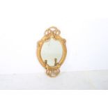 A CONTINENTAL GILT FRAME GIRANDOLE MIRROR the oval plate within a moulded frame with ribbon tied