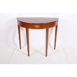 A SHERATON DESIGN MAHOGANY AND SATINWOOD INLAID SIDE TABLE of demilune outline the shaped top with