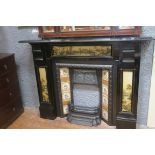 A GOOD BLACK MARBLE AND GILT CHIMNEY PIECE the rectangular shelf above a painted panel on moulded