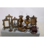 A SET OF FOUR BRASS PHOTO FRAMES together with a brass oil lamp salters scales etc etc