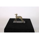 METAL AND POLYCHROME FIGURE modelled as a greyhound shown standing on a marble base 25cm (h) x 28cm