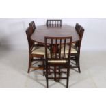 A SEVEN PIECE MAHOGANY DINING SUITE comprising six Georgian mahogany dining chairs each with a