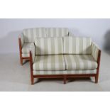 A PAIR OF CHERRYWOOD AND UPHOLSTERED TWO SEATER SETTEES each with a rectangular frame and loose