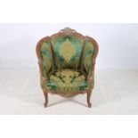 A CONTINENTAL WALNUT AND PARCEL TUB SHAPED CHAIR the pierced carved top rail above an upholstered