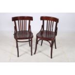 A PAIR OF BENTWOOD CHAIRS each with a curved back with vertical splats and panelled seat on