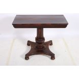 A 19TH CENTURY ROSEWOOD SIDE TABLE of rectangular outline the shaped top raised on a faceted