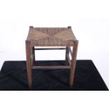 A VINTAGE RATTAN FOOTSTOOL 37cm x 33cm