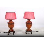 A PAIR OF CONTINENTAL GLAZED PORCELAIN AND METAL TABLE LAMPS each of urn form on metal stands with