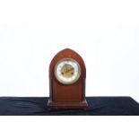 A 19TH CENTURY MAHOGANY AND BRASS BRACKET CLOCK of rectangular arched outline with brass columns