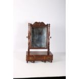 A GEORGIAN MAHOGANY CRUTCH FRAMED MIRROR the rectangular plate within a C scroll and paterae carved