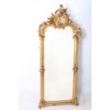A FINE 19TH CENTURY CONTINENTAL GILTWOOD AND GESSO MIRROR the rectangular bevelled glass plate
