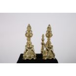 A FINE PAIR OF 19TH CENTURY BRASS FIRE DOGS each with a flame shaped finial above a baluster column