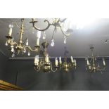 A PAIR OF BRASS FIVE BRANCH CHANDELIERS baluster column issuing five scroll arms with circular drip