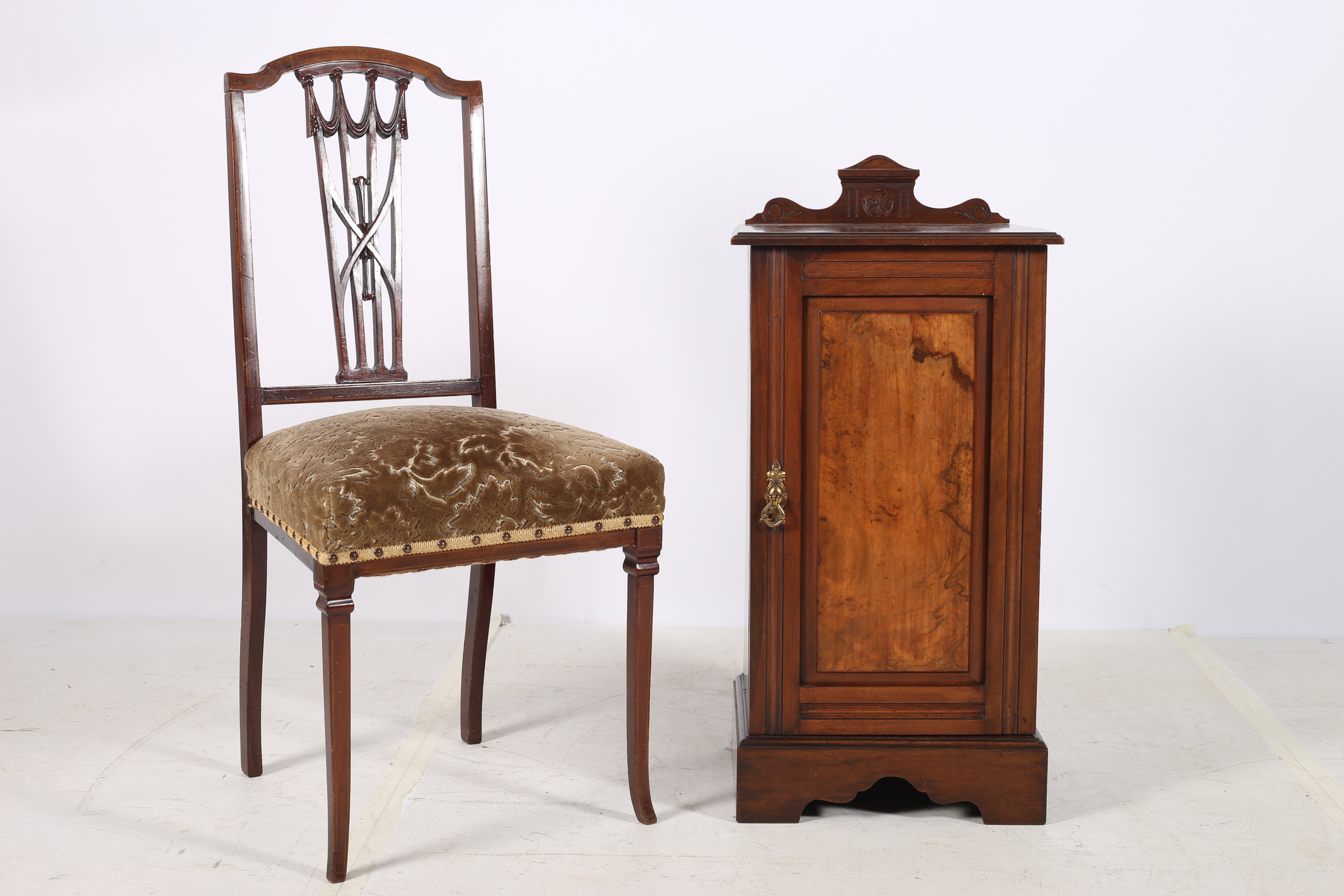 A 19TH CENTURY MAHOGANY AND WALNUT PEDESTAL of rectangular form with panelled door on shaped