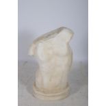 A COMPOSITION SCULPTURE modelled as a male torso raised on an oval waisted base 100cm x 70cm