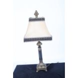 A CONTINENTAL GILT AND SIMULATED MARBLE TABLE LAMP with shade the cylindrical column above a square
