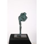 A FINE CAST BRONZE GREEN PATINATED FIGURE modelled as a bust raised on an arm on a rectangular