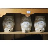 A SET OF THREE 19th CENTURY SPIRIT BARRELS, each of ovoid form moulded in relief with foliage,