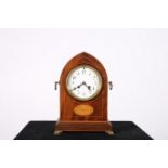 A 19TH CENTURY MAHOGANY AND SATINWOOD INLAID MANTLE CLOCK of rectangular arched form with enamel