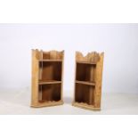 A PAIR OF PINE WALL MOUNTED CORNER SHELVES each with a moulded frieze above two open shelves
