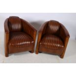 A VERY FINE PAIR OF AVIATION CHERRYWOOD AND HIDE UPHOLSTERED TUB SHAPED CHAIRS each with a panelled