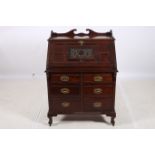 AN AMERICAN MAHOGANY BUREAU the rectangular top with moulded gallery above a carved and moulded