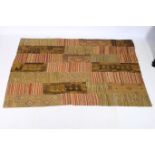 A TURKISH WOOL PATCHWORK RUG the mustard and gold ground patchwork panels filled with palmettes