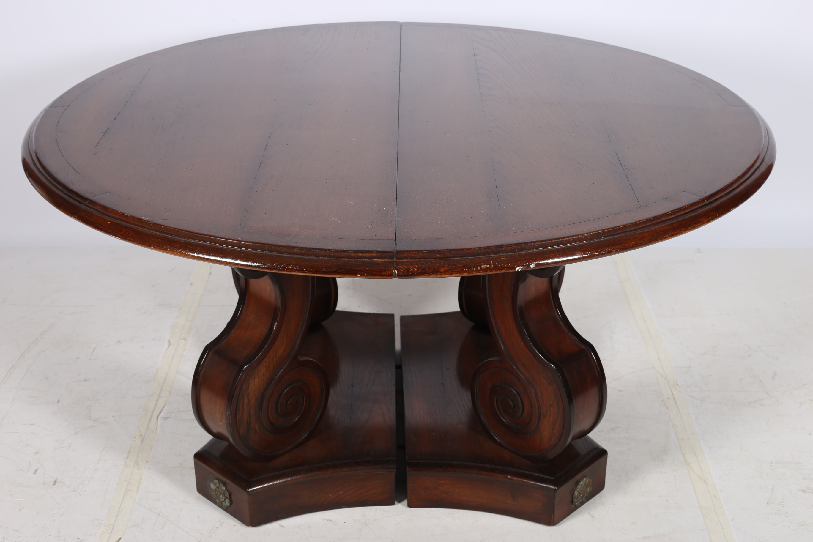 A FINE EMPIRE DESIGN OAK TELESCOPIC DINING TABLE the rectangular top with rounded ends and three