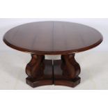 A FINE EMPIRE DESIGN OAK TELESCOPIC DINING TABLE the rectangular top with rounded ends and three