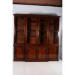 A FINE 19TH CENTURY MAHOGANY FOUR DOOR LIBRARY BOOKCASE of breakfront outline the moulded cornice
