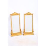 A PAIR OF 19TH CENTURY CONTINENTAL CARVED WOOD MIRRORS each of rectangular form with reeded frame