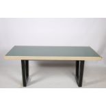AN AMERICAN TABLE CIRCA 1950s of rectangular outline with green glazed panel inset on ebonised