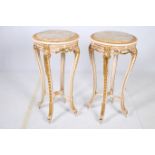 A PAIR OF CONTINENTAL GILTWOOD AND POLYCHROME TABLES each of circular form with veined marble inset