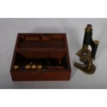A 19TH CENTURY BRASS MICROSCOPE BY R & J BECK LONDON #7471 in mahogany case