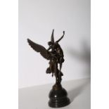 AFTER LEON MORICE A BRONZE FIGURE modelled as Victory in armour bearing a fallen warrior raised on