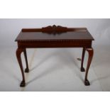 A CHIPPENDALE DESIGN MAHOGANY SIDE TABLE of rectangular outline with gadrooned rim and moulded