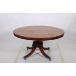 A 19TH CENTURY MAHOGANY POD TABLE the circular moulded top above a baluster column on quadruped