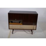 A RETRO TEAK CASED RADIOGRAM inscribed His Masters Voice 75cm (h) x 90cm (w) x 37cm (d)