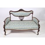 A 19TH CENTURY MAHOGANY AND UPHOLSTERED SETTEE the serpentine top rail with upholstered back and