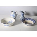 TWO BLUE AND WHITE WASH BASINS AND JUGS each decorated with flower heads and foliage