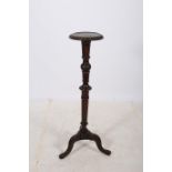 A CARVED MAHOGANY JARDINIERE STAND the circular dish top above a baluster fluted column on tripod