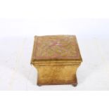 A 19TH CENTURY MAHOGANY AND UPHOLSTERED STOOL the hinged lid above a shaped base on bun feet 39cm