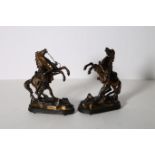 A PAIR OF SPELTER FIGURES modelled as Marley horses with handlers shown rearing on a naturalistic